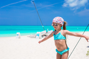 Adorable little girl have fun during caribbean vacation