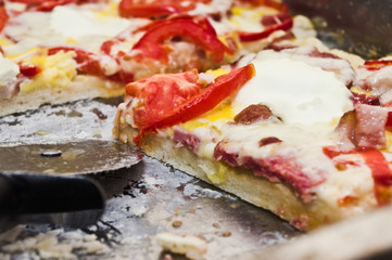 Homemade pizza on a baking tray