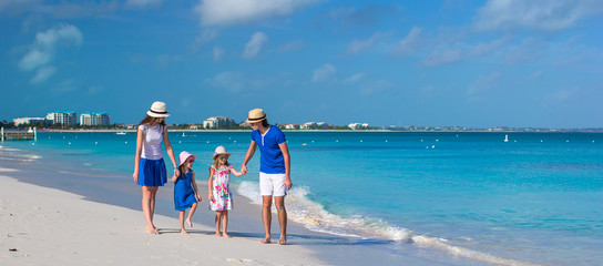 Young beautiful family with two kids on caribbean vacation