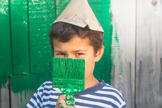 young boy painting