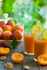 Fresh apricot juices, vertical