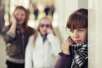 Teenage girls in conflict at the school building