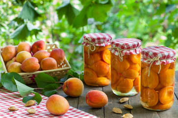 Jars with apricot and apricot fruit