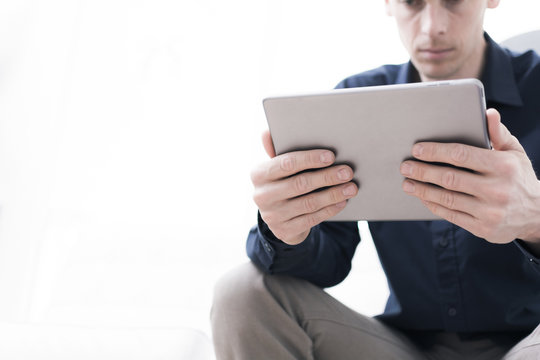 Young man on tablet pc