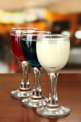 Tasty color liquors, on bright background