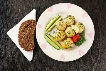 Young boiled potatoes on table, close up