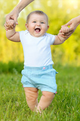 cute little baby doing first steps