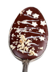 Spoon with tasty chocolate for party. Isolated on white
