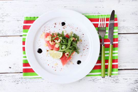 Salad with watermelon, feta, arugula, shrimps, balsamic sauce