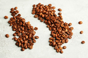 Coffee beans on color wooden background