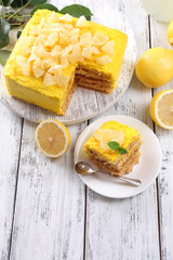 Tasty lemon dessert on wooden table