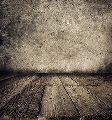 Rough brown wooden floor boards and stone wall background