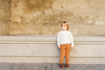 Outdoor portrait of a cute toddler boy © annanahabed