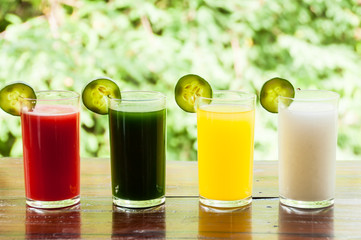 Colorful glasses of fruit and vegetable juice