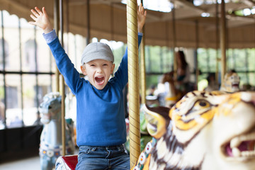 boy at carousel