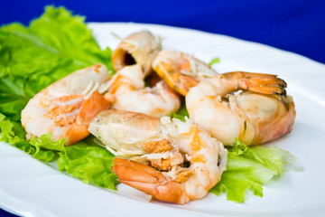 shrimp on a plate with vegetable salad