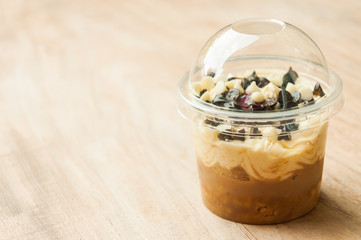 banoffee oreo pie in a cup, spilled with caramel and whipped cre