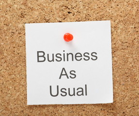 Business as Usual reminder on a cork notice board