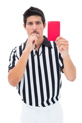 Serious referee showing red card
