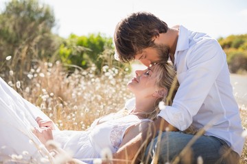 Attractive couple relaxing in the countryside