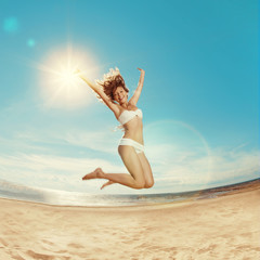 Woman on the beach. Young girl on the sand by sea. Stylish beaut