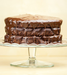 Delicious melted chocolate cake on brown background