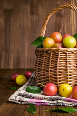 Plums in a wicker basket.