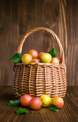Plums in a wicker basket