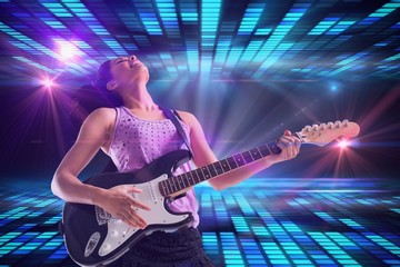 Naklejka na ściany i meble Composite image of pretty girl playing guitar