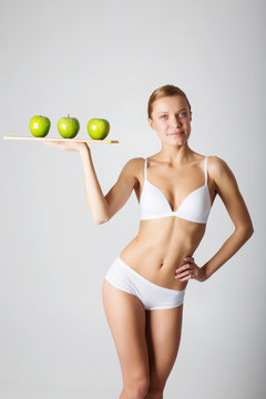 Taned happy fit woman. Diet, healthy lifestyle and body care con