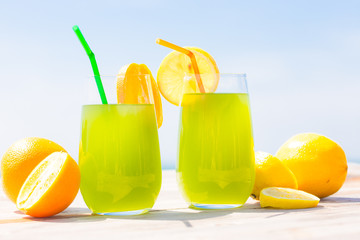Fototapeta premium Refreshing fruity juice with the fresh lemon and orange