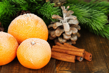 Christmas composition with frosted ripe tangerines
