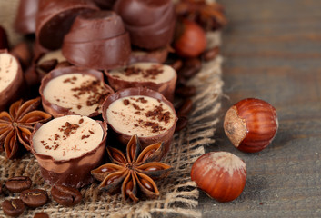 Tasty chocolate candies with coffee beans and nuts