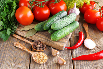 Fresh vegetables with herbs and spices on table, close-up
