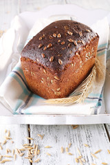 Fresh bread on wooden table, close up