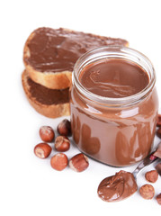 Sweet chocolate cream in jar isolated on white