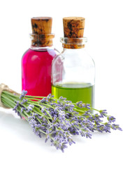 Obraz na płótnie Canvas Aroma oil with lavender flowers on a white background