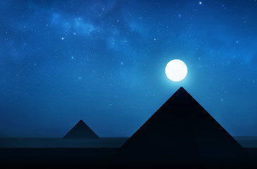 Ancient pyramids at night - night sky filled with stars © pixel