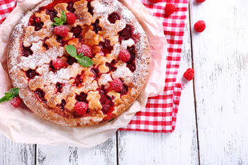 Tasty cake with berries on table close-up