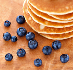 Stack of pancakes with fresh blueberries