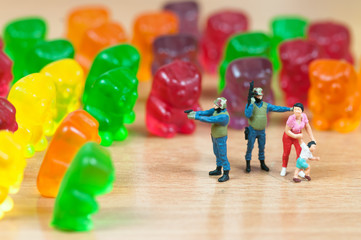 Gummy bear invasion. Harmful/ junk food concept