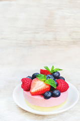 souffle cake with fresh raspberries, blueberries and strawberrie