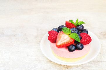 souffle cake with fresh raspberries, blueberries and strawberrie