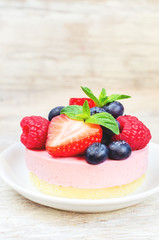 souffle cake with fresh raspberries, blueberries and strawberrie