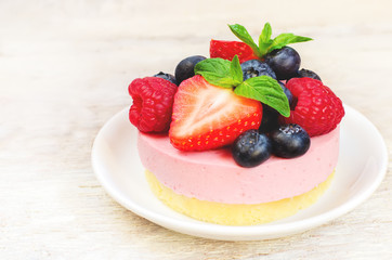 souffle cake with fresh raspberries, blueberries and strawberrie