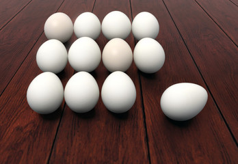 Dozen of eggs on wooden background