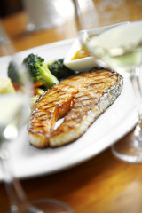 close up salmon steak in white dish