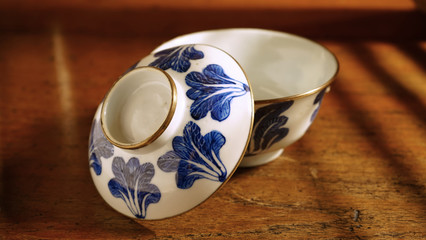 Chinese blue and white ceramic bowl on wooden table