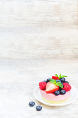 souffle cake with fresh raspberries, blueberries and strawberrie