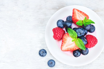 souffle cake with fresh raspberries, blueberries and strawberrie